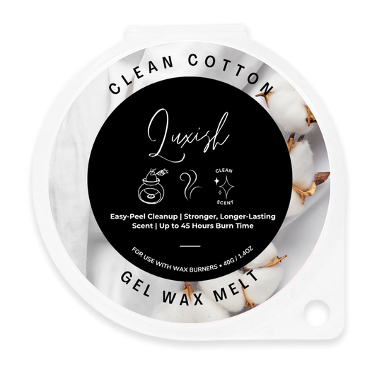 A round gel wax melt container labeled 'Clean Cotton' by Luxish, featuring a black center label with white text and cotton imagery on a white background.